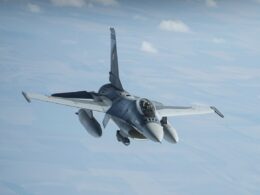 A Romanian F-16 fighter jet in the sky.