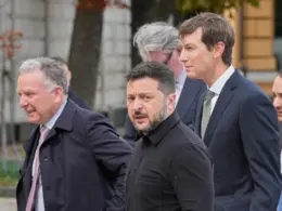 Ukraine's President Volodymyr Zelenskyy, center, and U.S. President Donald Trump's envoys Jared Kushner, right, and Steve Witkoff, left, walk prior to their talks in Kyiv, Ukraine, Sunday, Sept. 6, 2026. (AP Photo/Efrem Lukatsky)