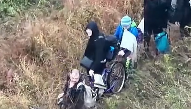 Civilians led through a gas pipeline out of the Kupiansk community, Kharkiv Oblast, by people the Khartiia Corps identifies as Russian forces, 27 September 2026