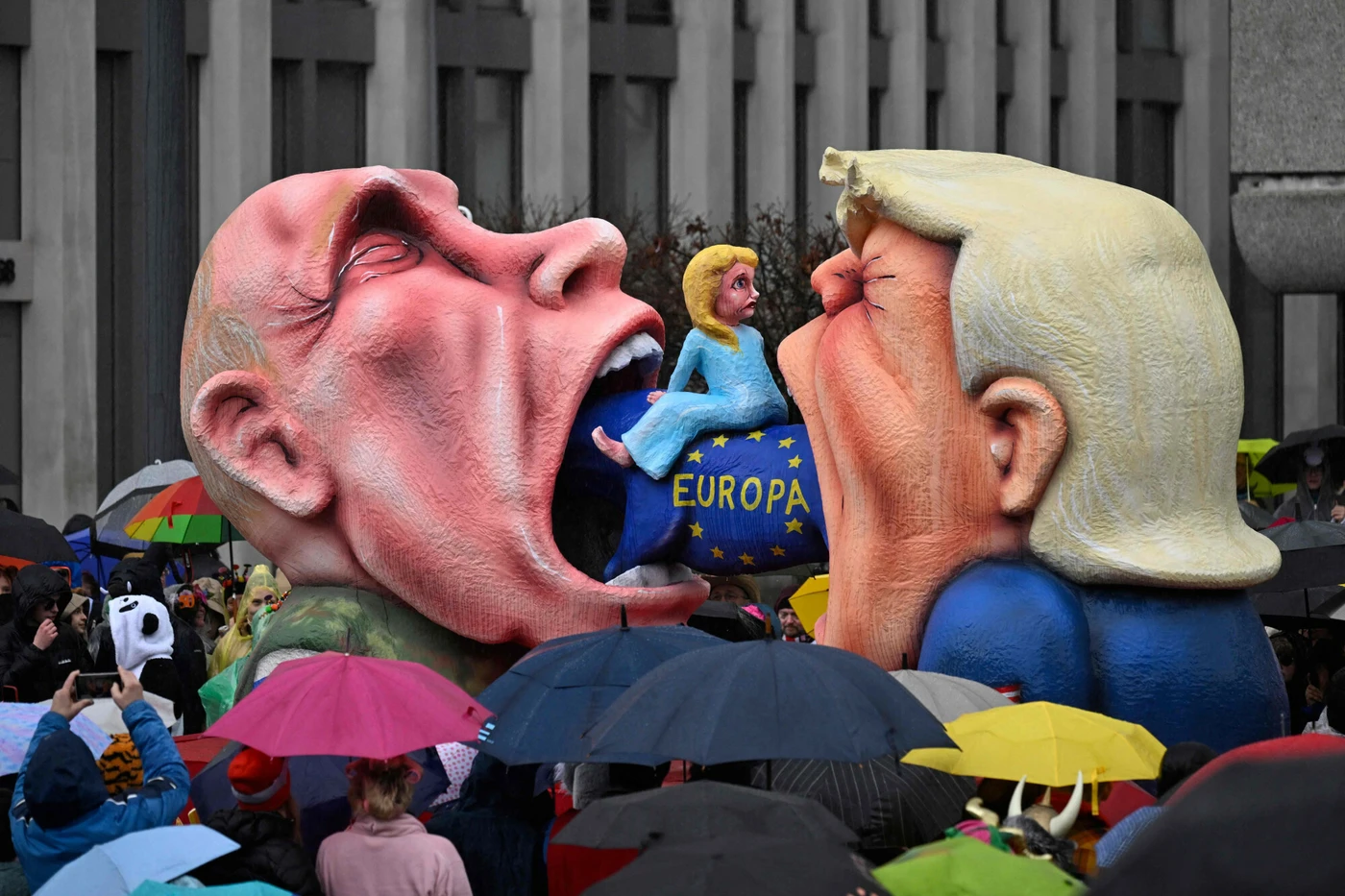 A carnival float by Jacques Tilly shows Trump and Putin eating a cow ridden by Ursula von der Leyen, at the Rose Monday parade in Düsseldorf, Germany, on 16 February 2026. Photo: Ina Fassbender/AFP/Eastnews