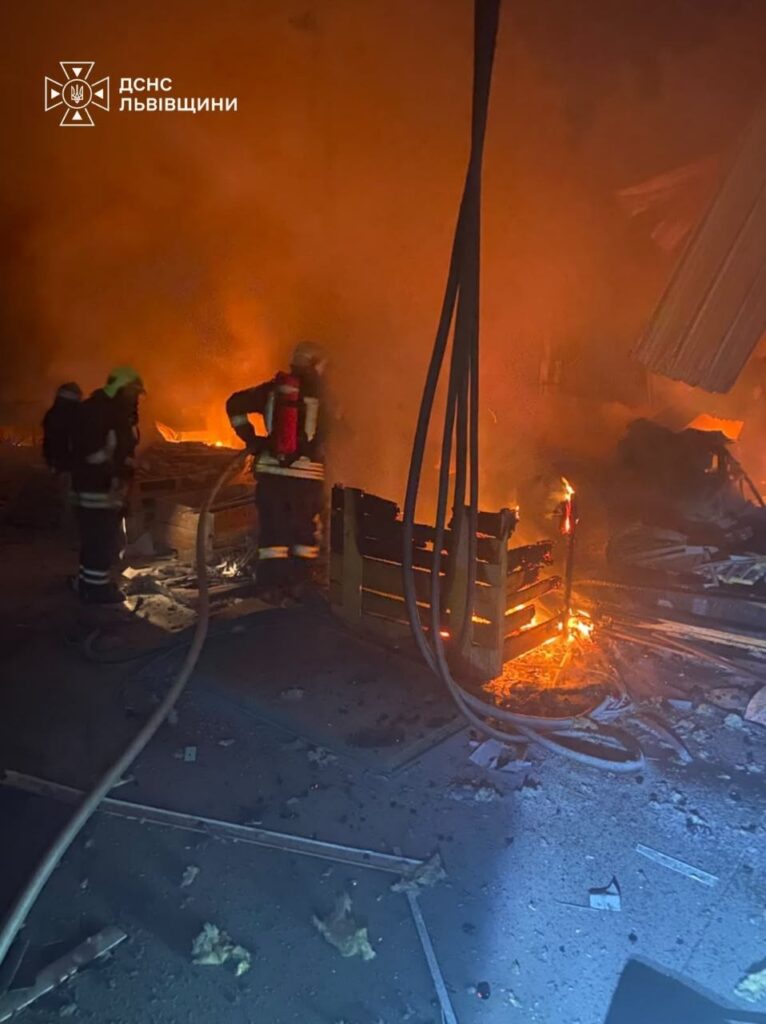 Firefighters put out a fire at an enterprise in Lviv district after a Russian attack, 21 October 2026.